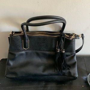 Purse with gold trim and tassels, big and lots of pockets with zippers